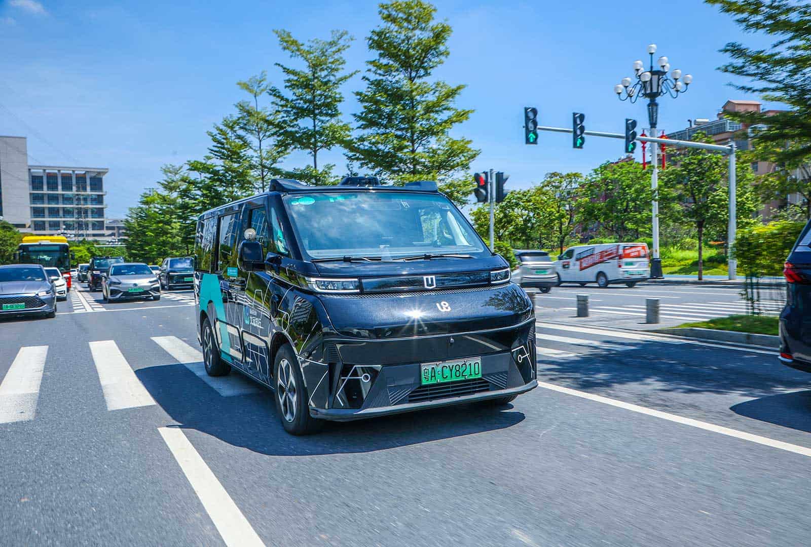 Autonomous shuttle vehicle navigating urban traffic with safety and precision.