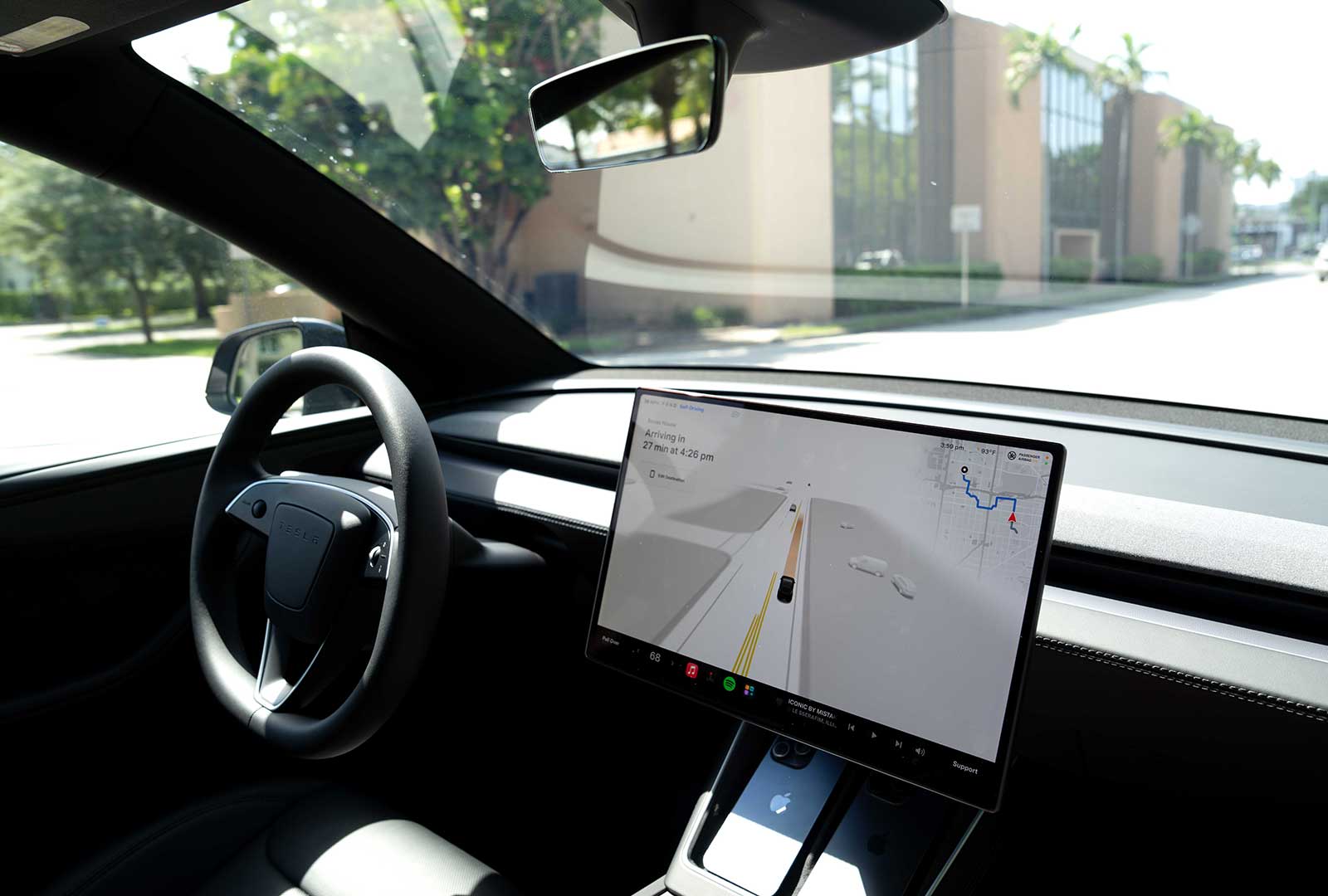 Tesla vehicle with autonomous driving system on display in Florida.