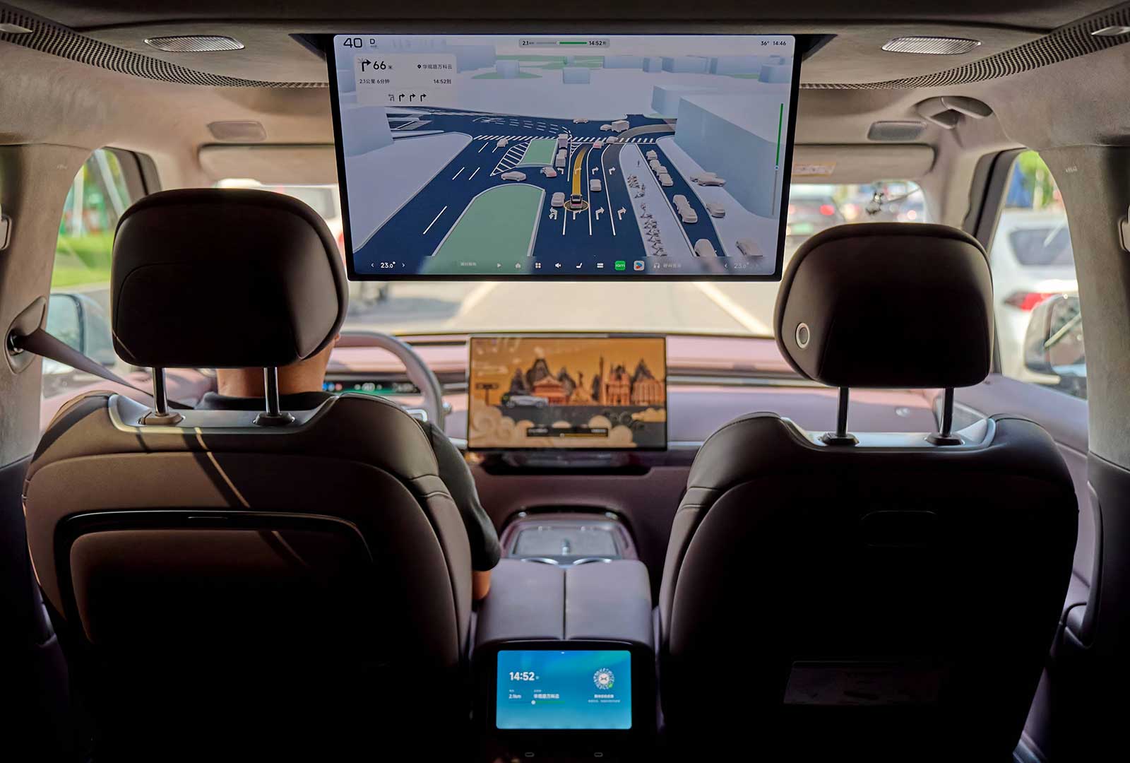 Inside an autonomous vehicle showing navigation and control screens for road safety.